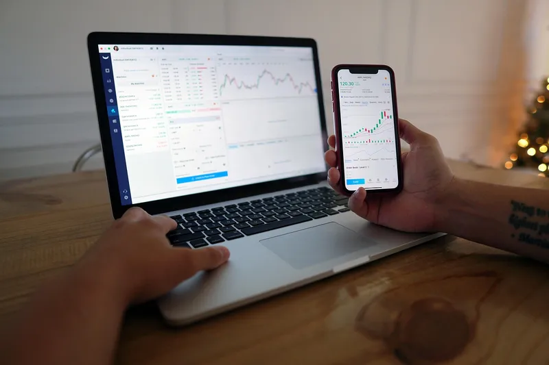 Man, computer, stock trading, iphone